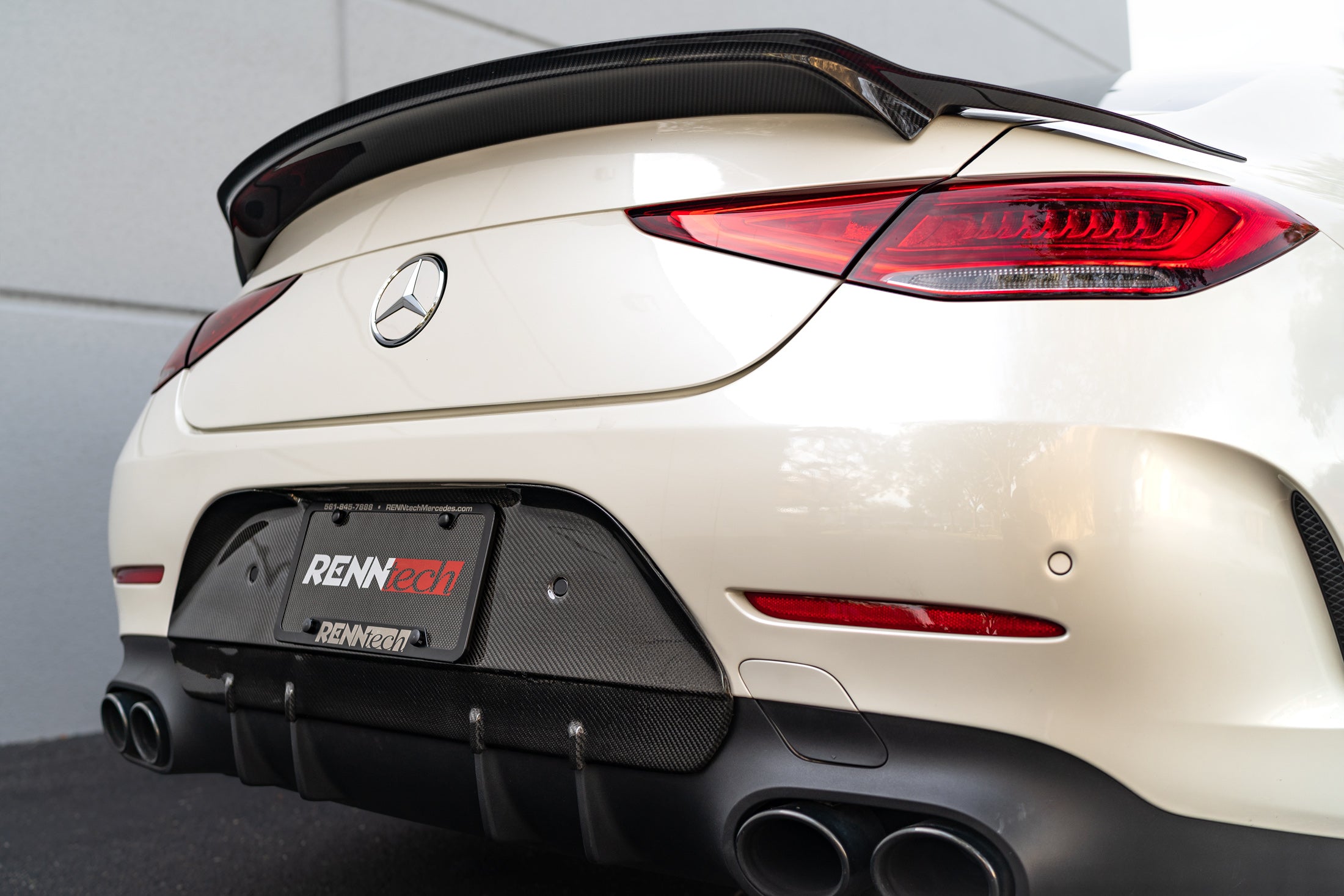 White CLS car rear with the carbon bumperette delete and spoiler - Carbon Bumperette Delete for the 2019-2023 CLS-Class