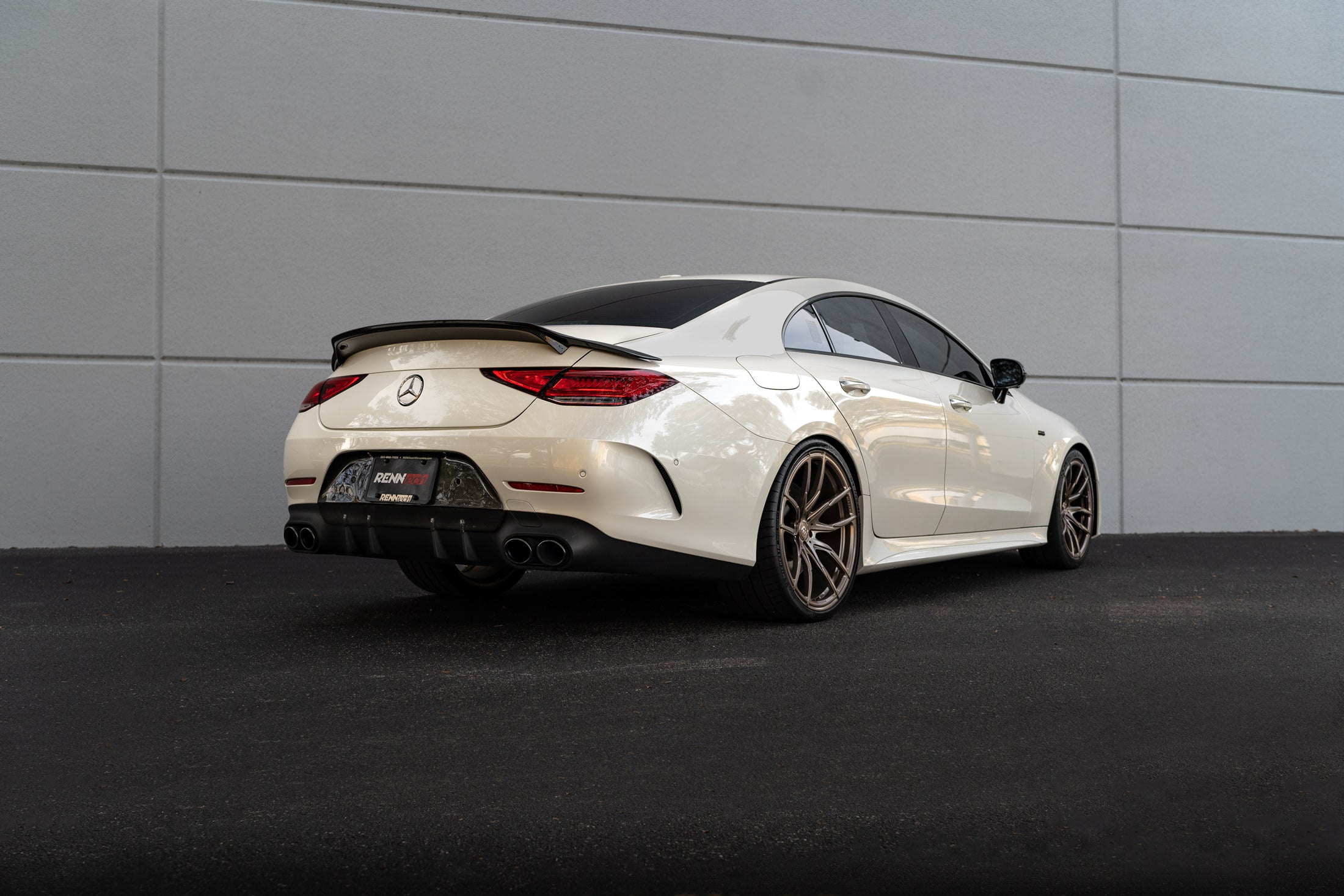 White CLS car rear quarter with the bumperette delete - Carbon Bumperette Delete for the 2019-2023 CLS-Class