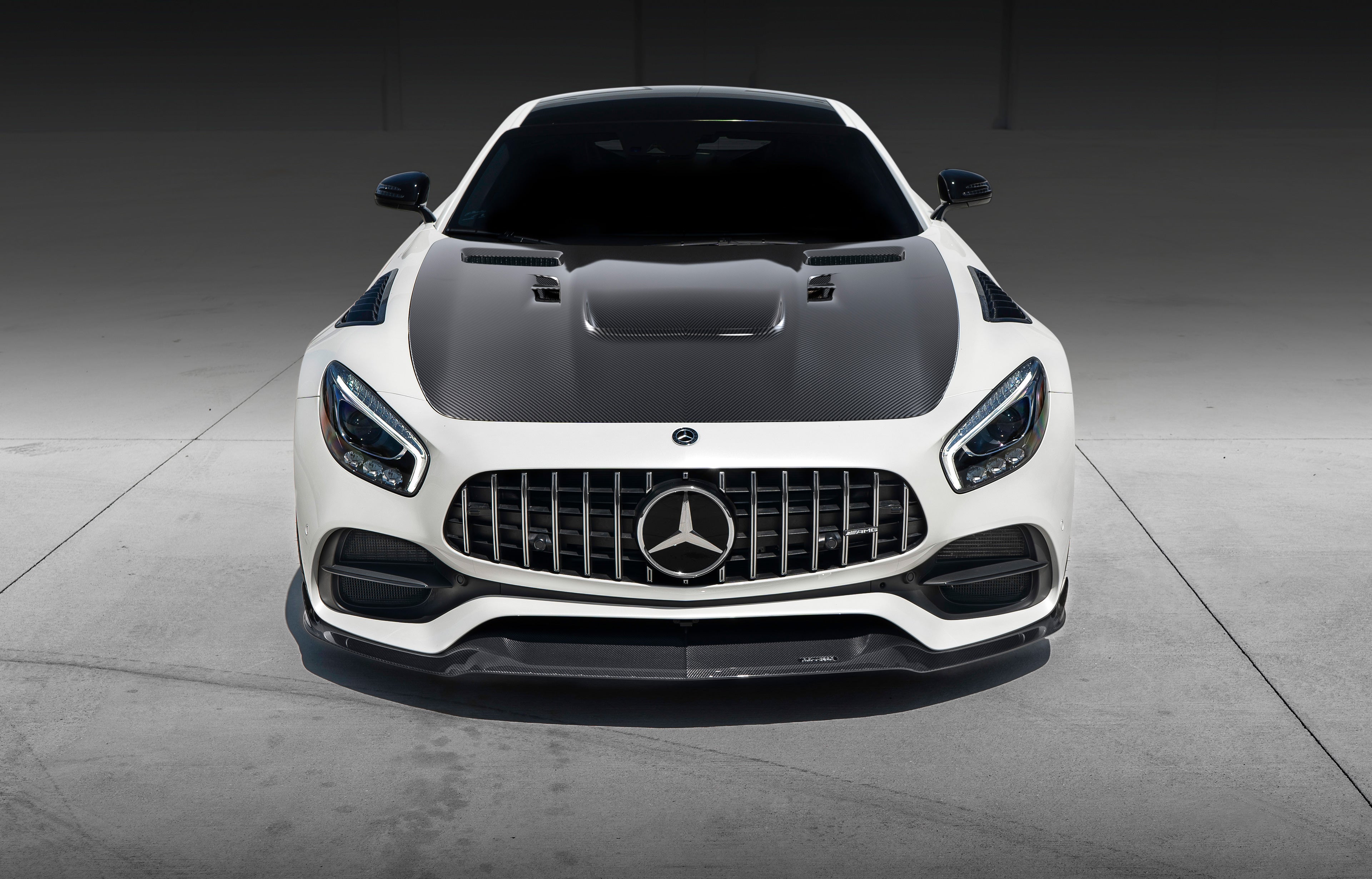 White AMG GT car front view with the RennTech carbon hood - Carbon Fiber Hood for the 2016-2021 AMG GT