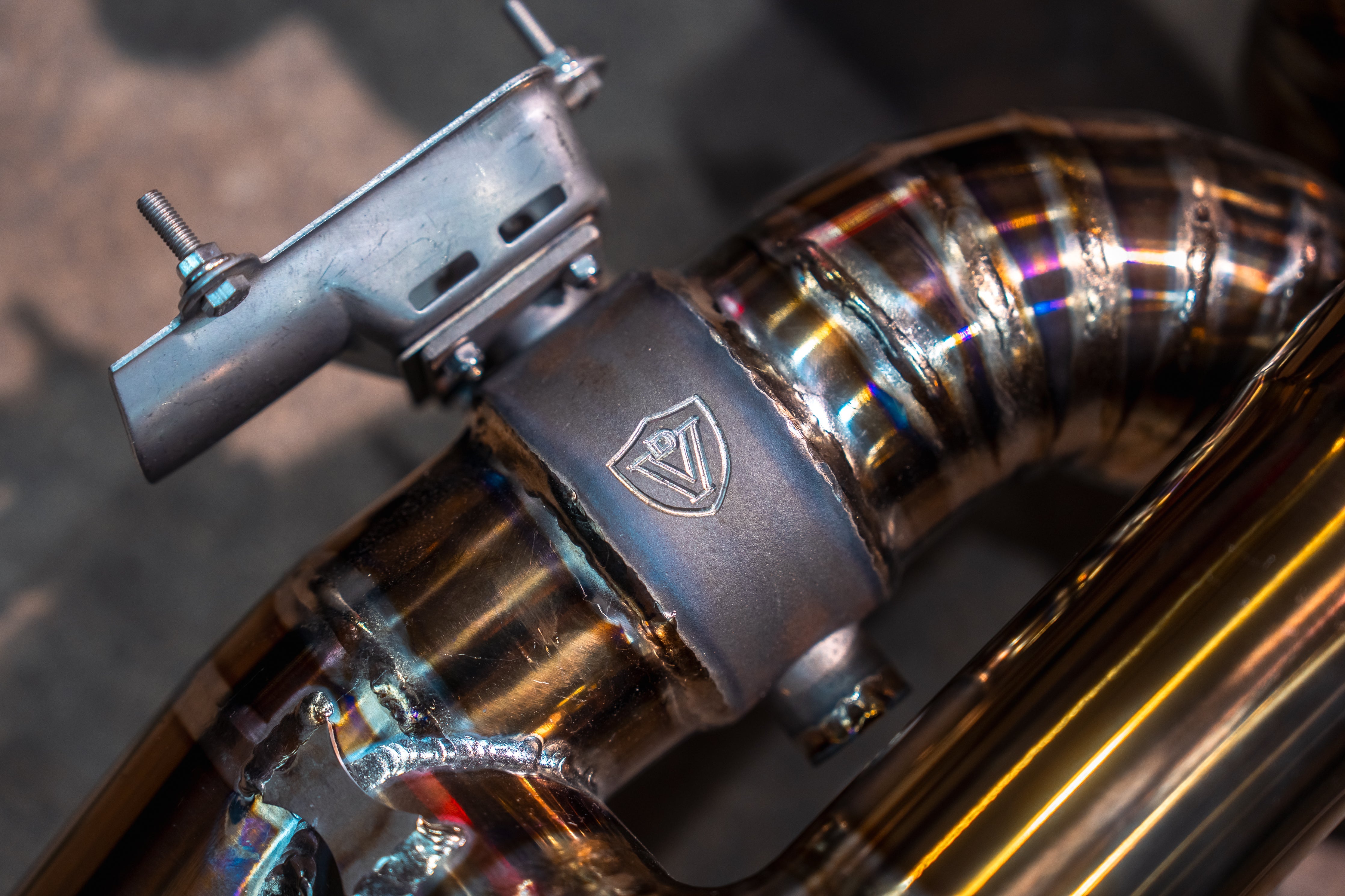 Valvetronic Designs Exhaust Aston Martin DB11 5.2L manufacturer gallery: electronic valve actuator beside the segmented rear branch