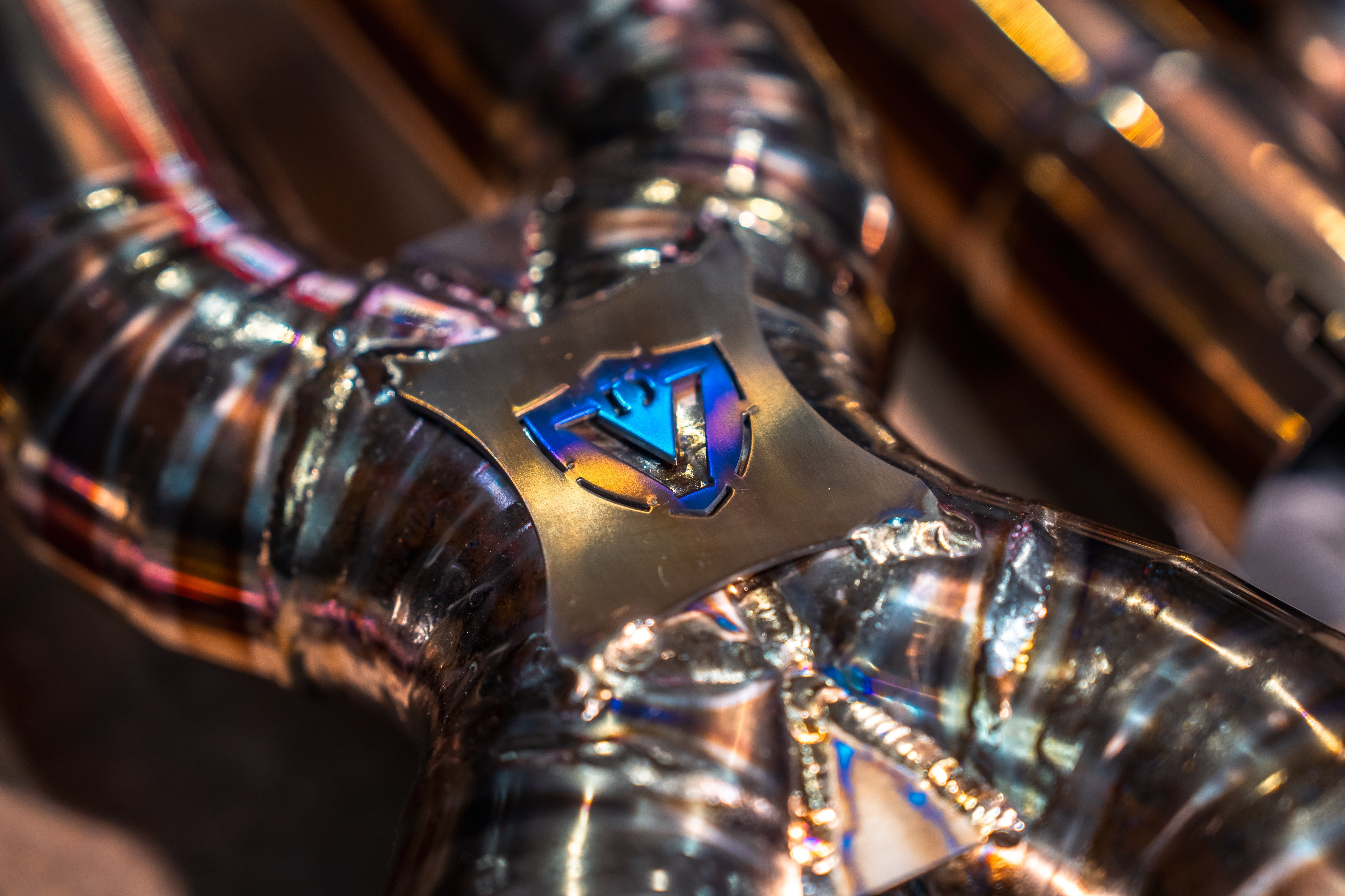 Valvetronic Designs Exhaust Aston Martin DB11 5.2L manufacturer gallery: shield brace over the crossover welds viewed diagonally