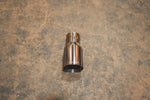 A top view of a single Valvetronic Designs Exhaust Tip in Single Wall Chrome on the ground.