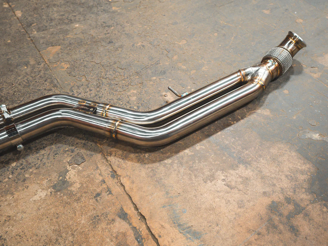 A top view of a part of Valvetronic Designs Valved Sport Exhaust System on the ground (for BMW F87 M2).