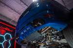 Valvetronic Designs Exhaust Range Rover Sport L494 manufacturer gallery: installed exhaust below the rear corner of a blue Range Rover