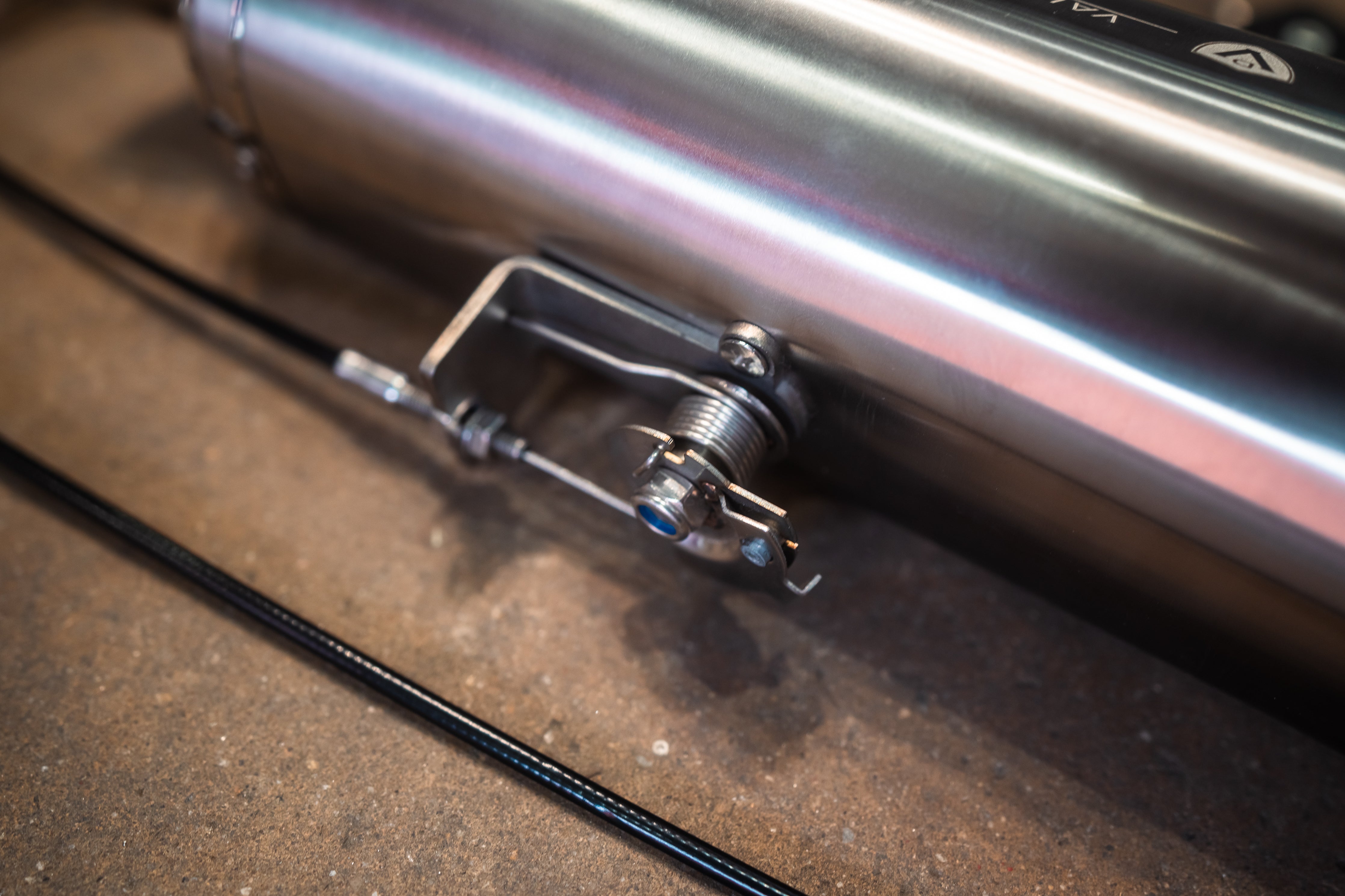 Valvetronic Designs Motorcycle Valved Muffler manufacturer gallery: mounting latch on the muffler housing