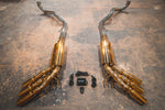 A top overview of Valvetronic Designs Valved Sport Exhaust System with free flow bypass pipes, valve controllers and wires on the ground (for Mercedes Benz G-Wagon G550, G63 / Squared).