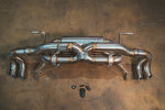 Valvetronic Designs Exhaust Lamborghini Gallardo LP manufacturer gallery: rear exhaust and small control parts laid out horizontally