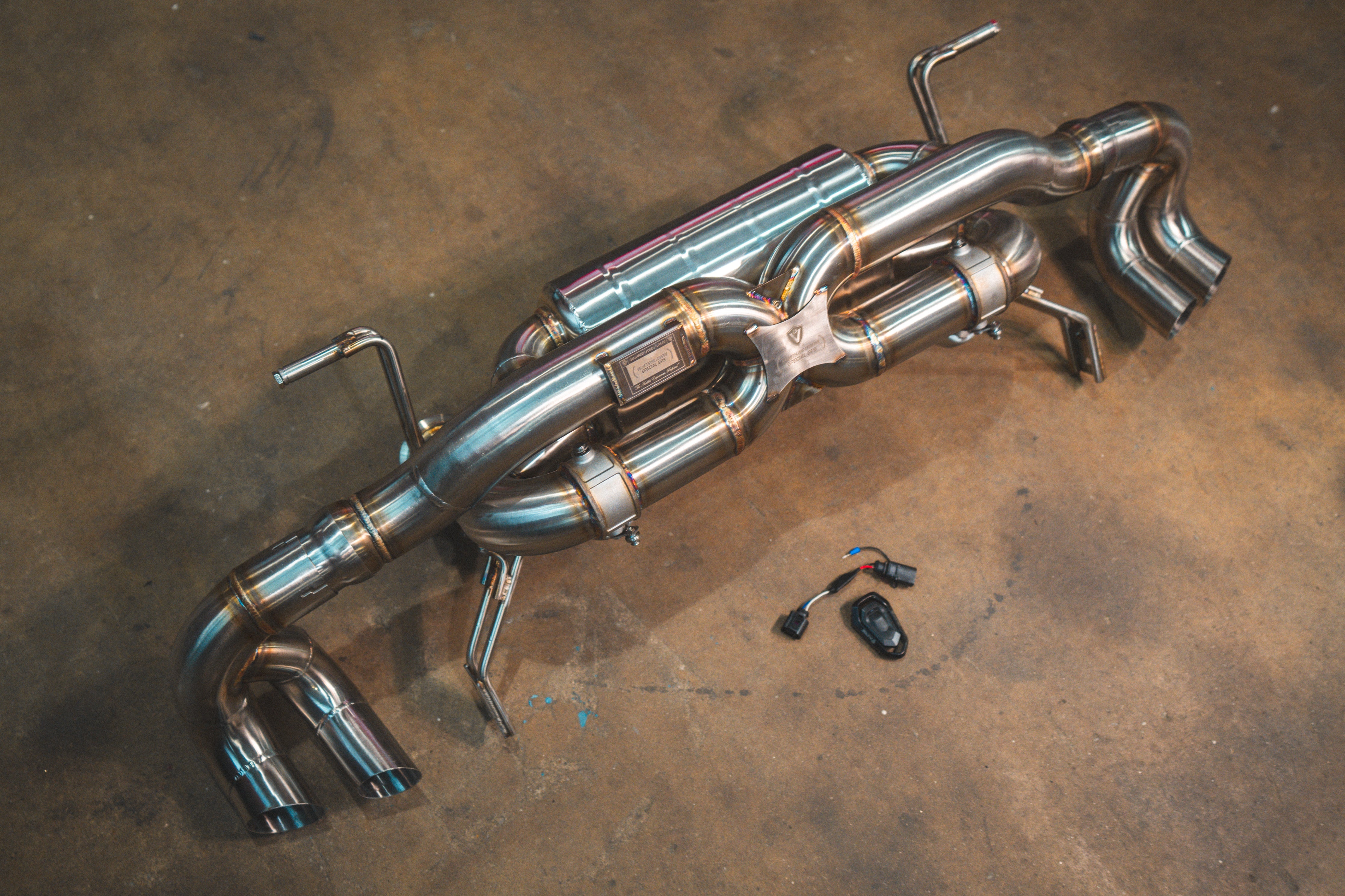 Valvetronic Designs Exhaust Lamborghini Gallardo LP manufacturer gallery: rear exhaust laid diagonally beside the control parts