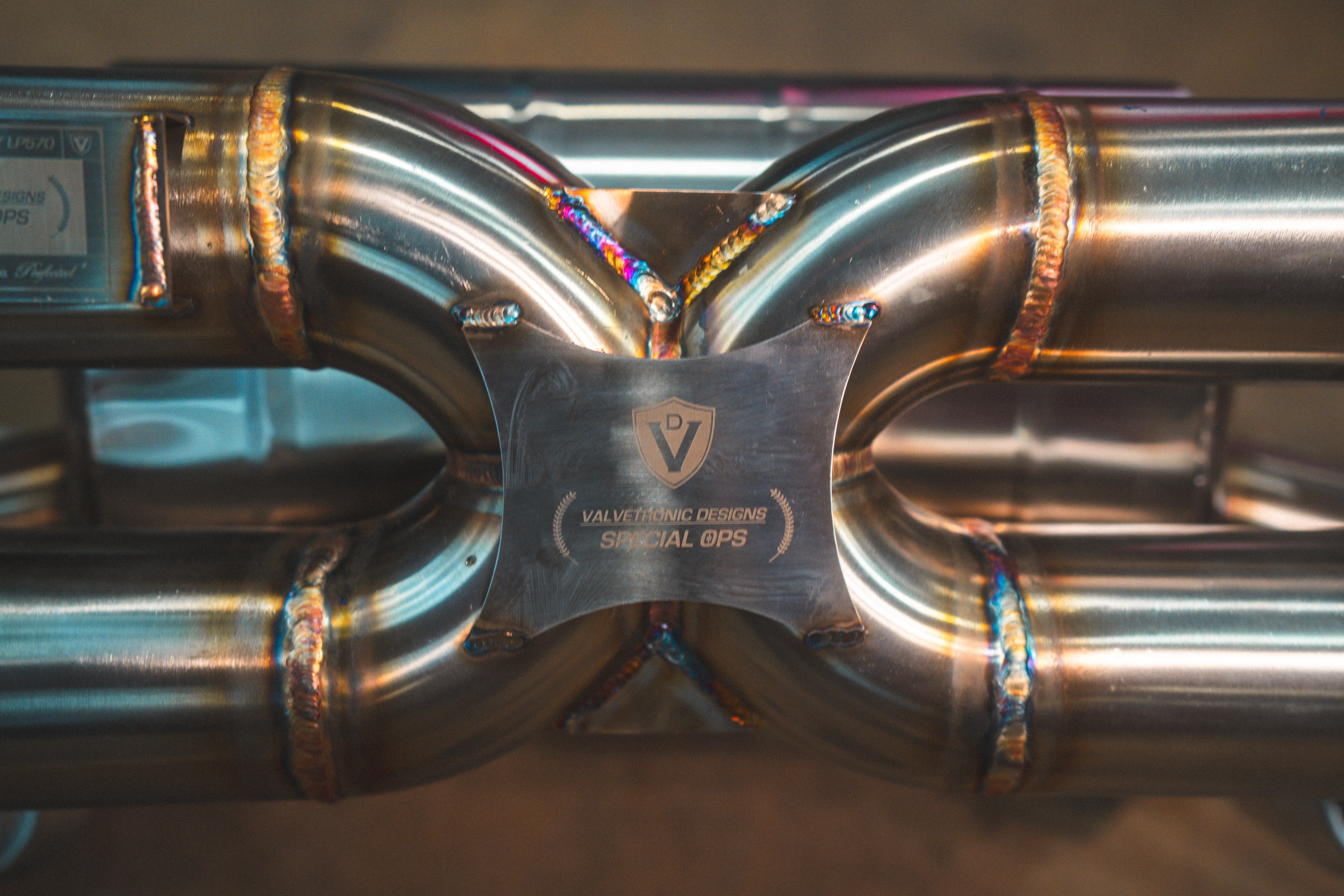 Valvetronic Designs Exhaust Lamborghini Gallardo LP manufacturer gallery: central crossover tubes and identification plate viewed overhead