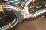Valvetronic Designs Exhaust Lamborghini Gallardo LP manufacturer gallery: angled close-up of the crossover welds and plate