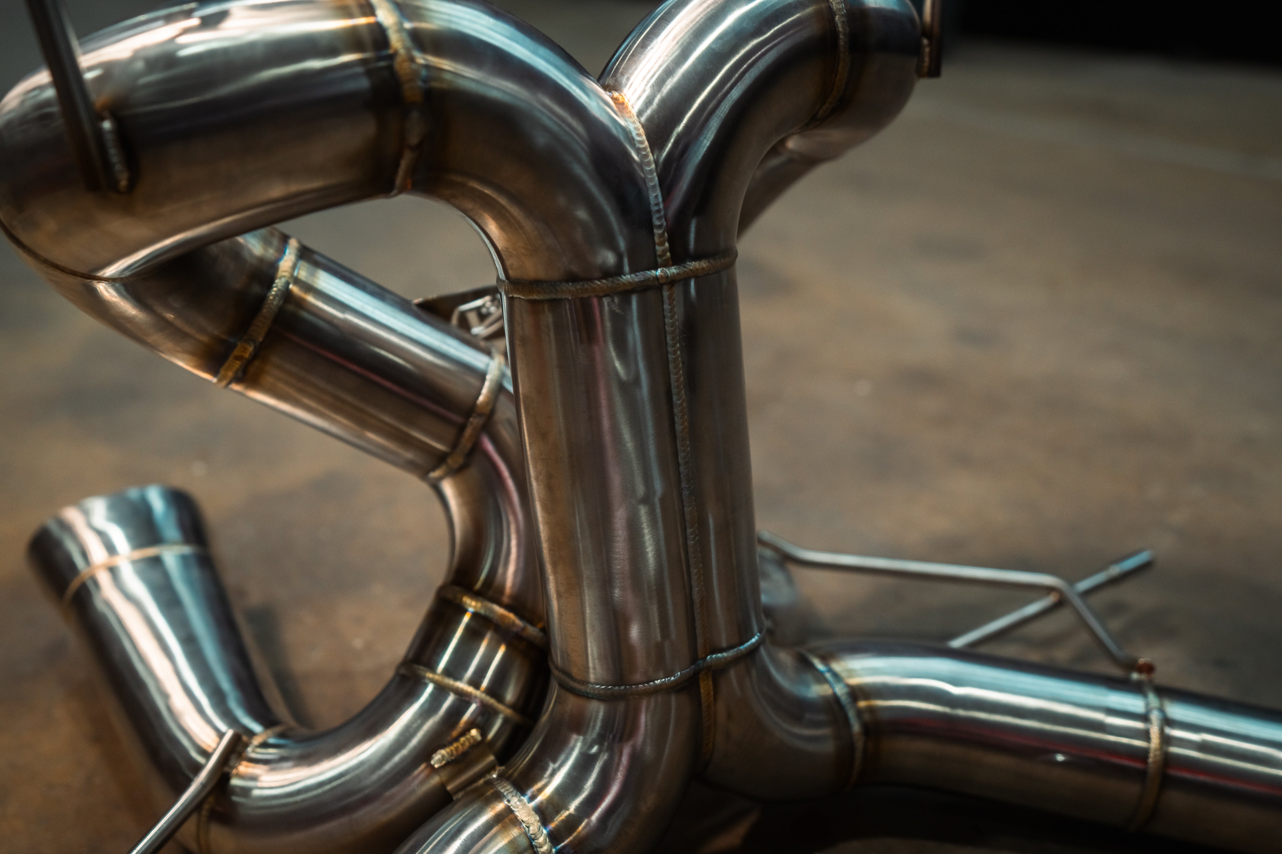 Stainless F1 exhaust Lamborghini Revuelto: curved rear tubing
