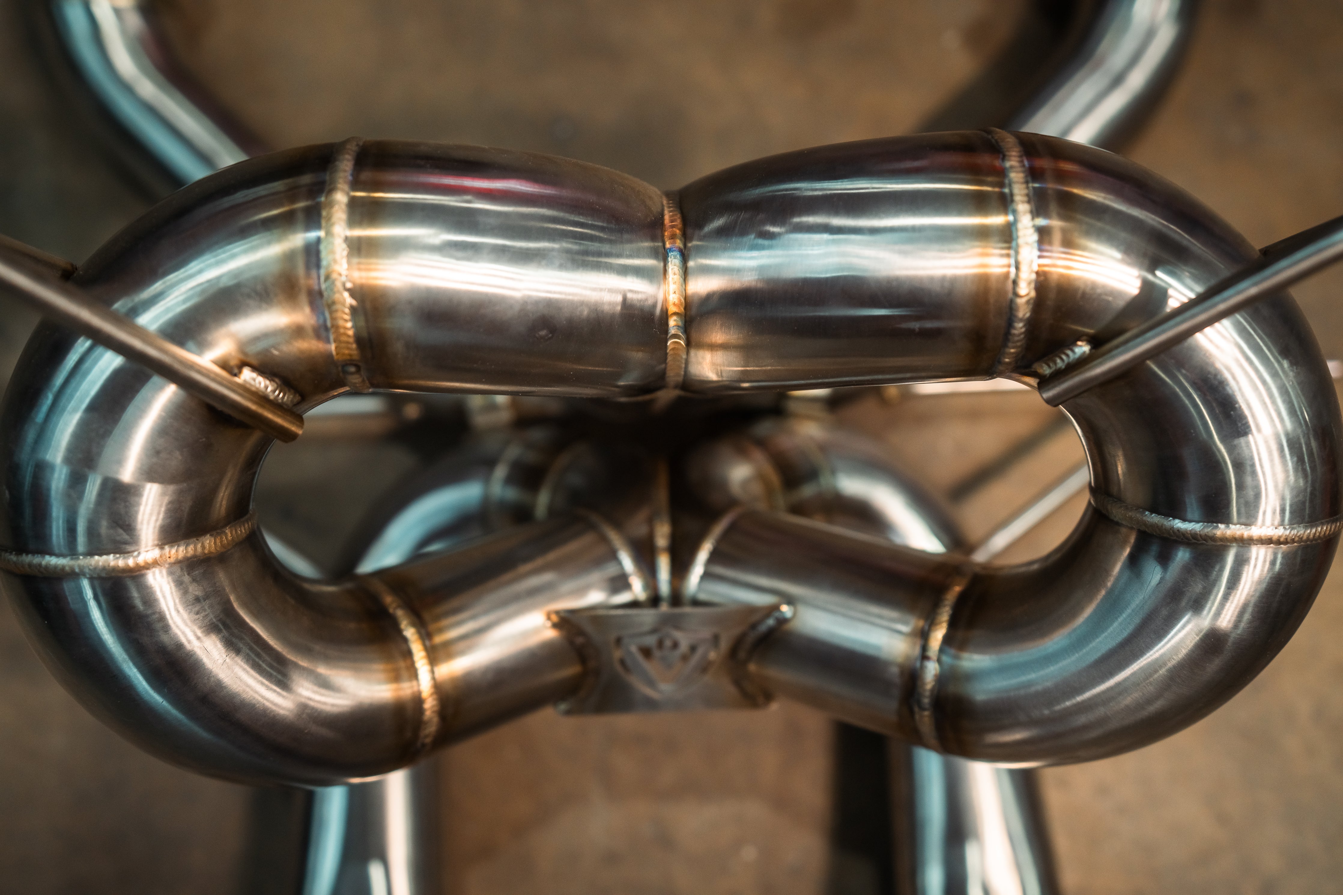 Stainless F1 exhaust Lamborghini Revuelto: double X-pipe overhead
