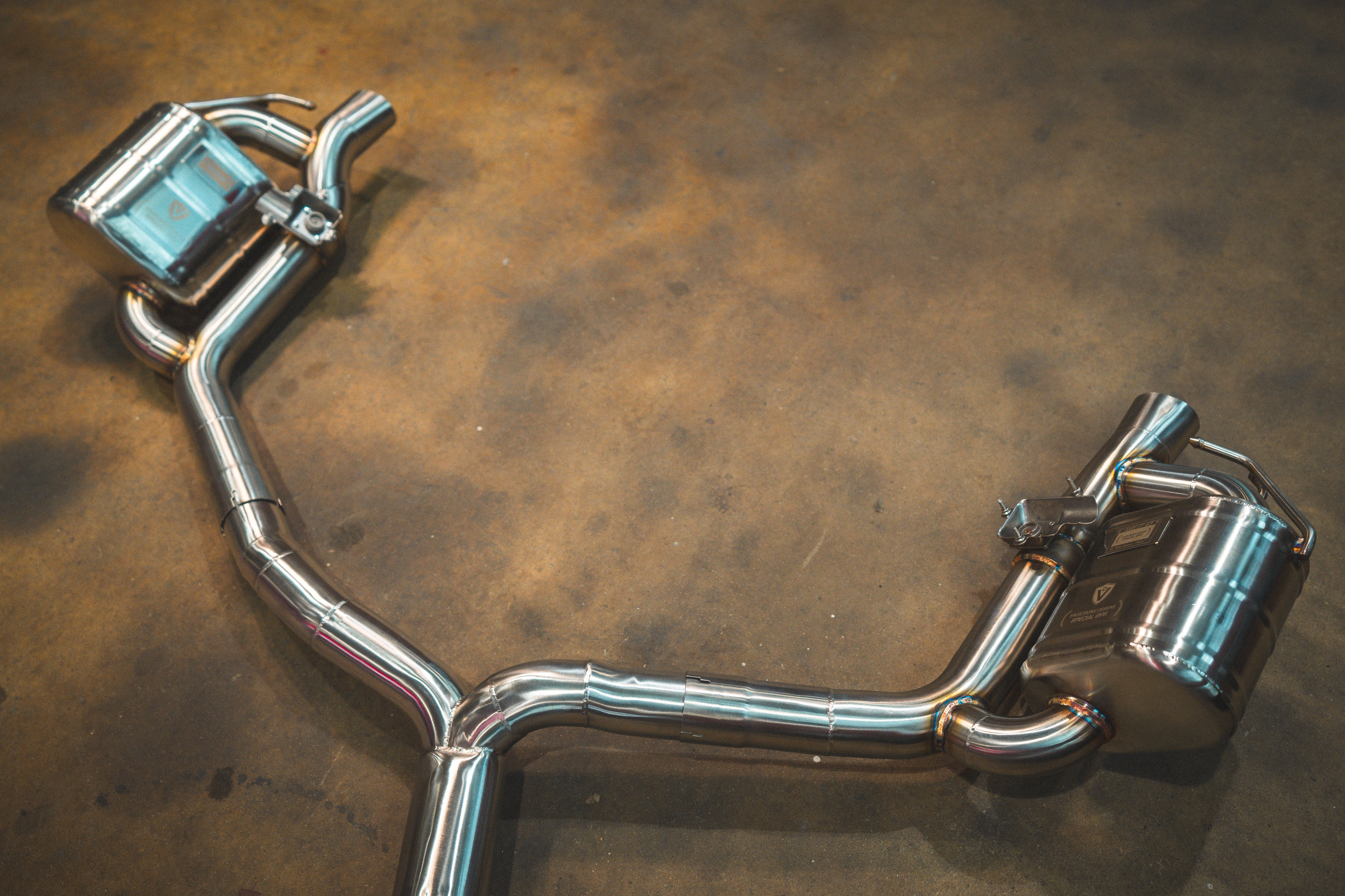 Valvetronic Designs Valved Exhaust AMG GT 43 manufacturer gallery: twin rear mufflers and Y-shaped branches viewed diagonally