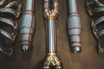 Stainless exhaust Aston Martin DBS: midpipe and resonators laid out