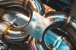 Stainless exhaust Aston Martin DBS: valve bridge close-up