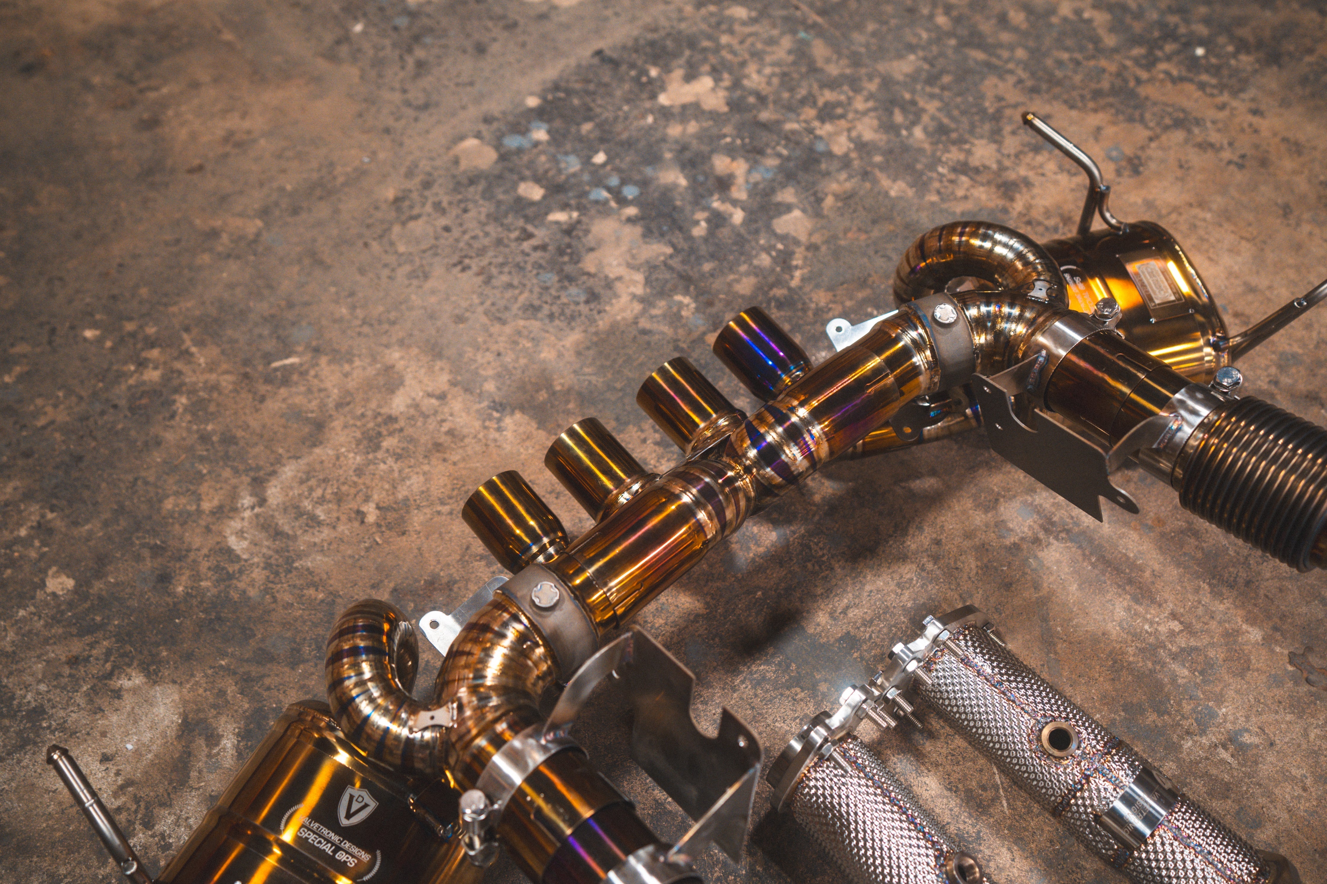 Valvetronic Designs Valved Exhaust Corvette C8 Z06 manufacturer gallery: parallel exhaust tubes beside the shielded front components