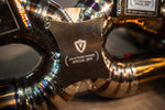 Titanium exhaust Maserati MC20: central logo bridge