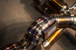 Titanium exhaust Maserati MC20: curved pipe elbow