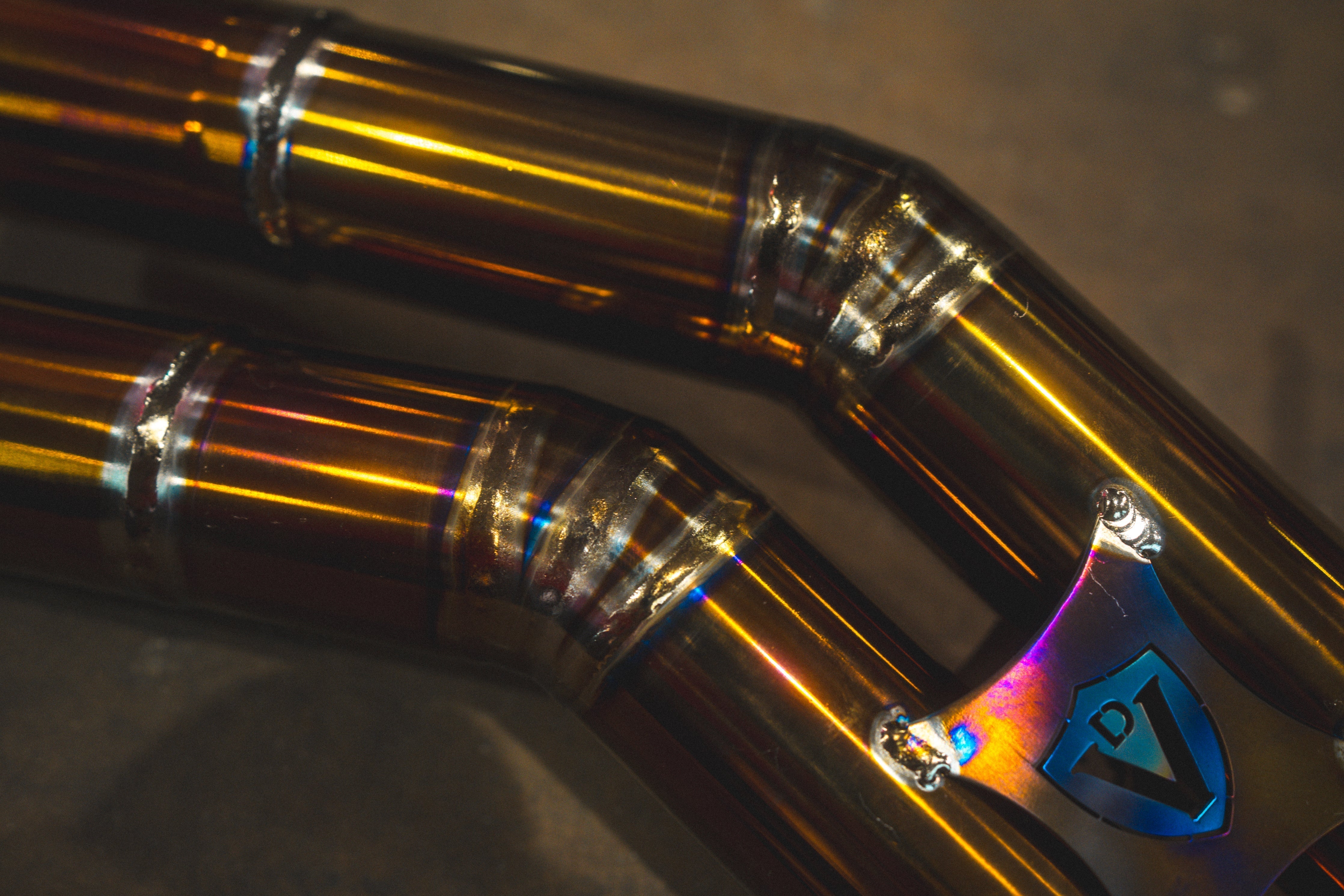 Valvetronic Designs Valved Exhaust Porsche Macan manufacturer gallery: blue shield brace between parallel mid-pipes