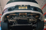 Valvetronic Designs Exhaust Porsche 992 Carrera / Turbo manufacturer gallery: exhaust installed beneath the rear of a white Porsche on a lift