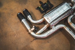 Valvetronic Designs Exhaust BMW F85 X5M / F86 X6M manufacturer gallery: polished rear muffler and paired dark tips with controller above