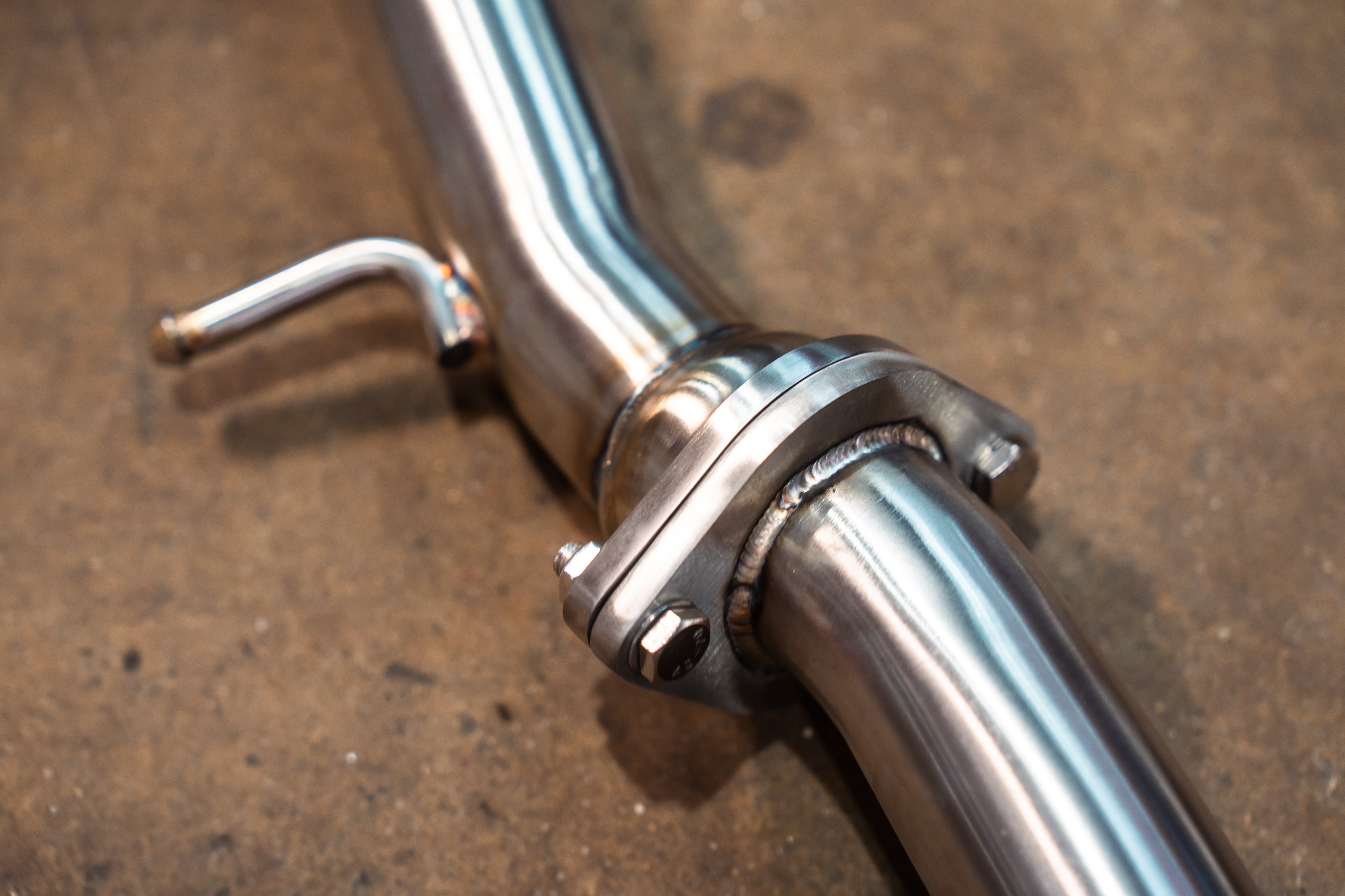 Valvetronic Designs Valved Exhaust Lexus RC F manufacturer gallery: front flange joint and hanger viewed from above
