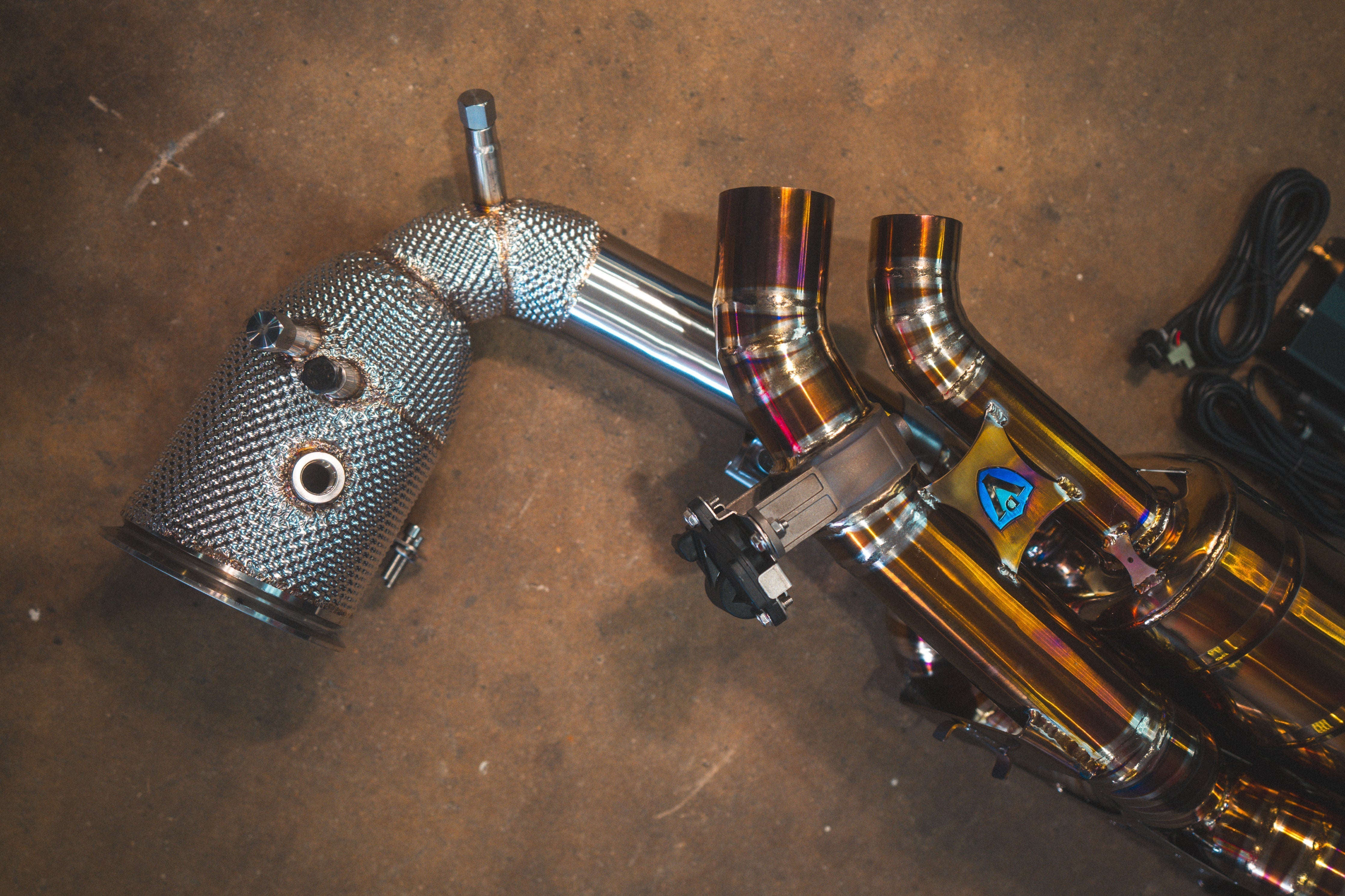 Valvetronic Designs Exhaust Porsche 992 Carrera / Turbo manufacturer gallery: rear exhaust beside an optional heat-shielded catted downpipe