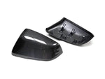 A back and front view of AUTOTECKNIC REPLACEMENT VERSION II DRY CARBON MIRROR COVERS - TOYOTA A90 SUPRA 2020+ with white background