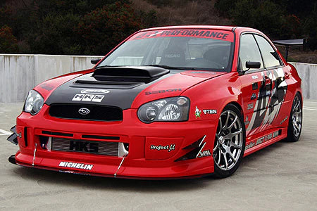 A front side view of a red car fitted with APR Performance SS/GT Widebody Aerodynamic Kit Subaru Impreza WRX 2004-2005