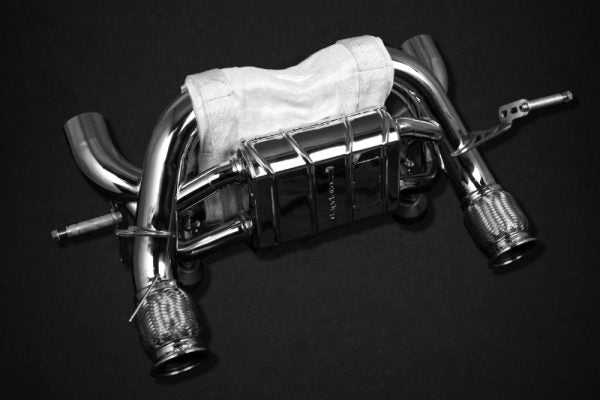 wide top view of Capristo Valved X Pipe Exhaust (for OEM tips) with Heat Protection for Lamborghini Huracan Performante/EVO/STO/Tecnica 2018-2024 with black background