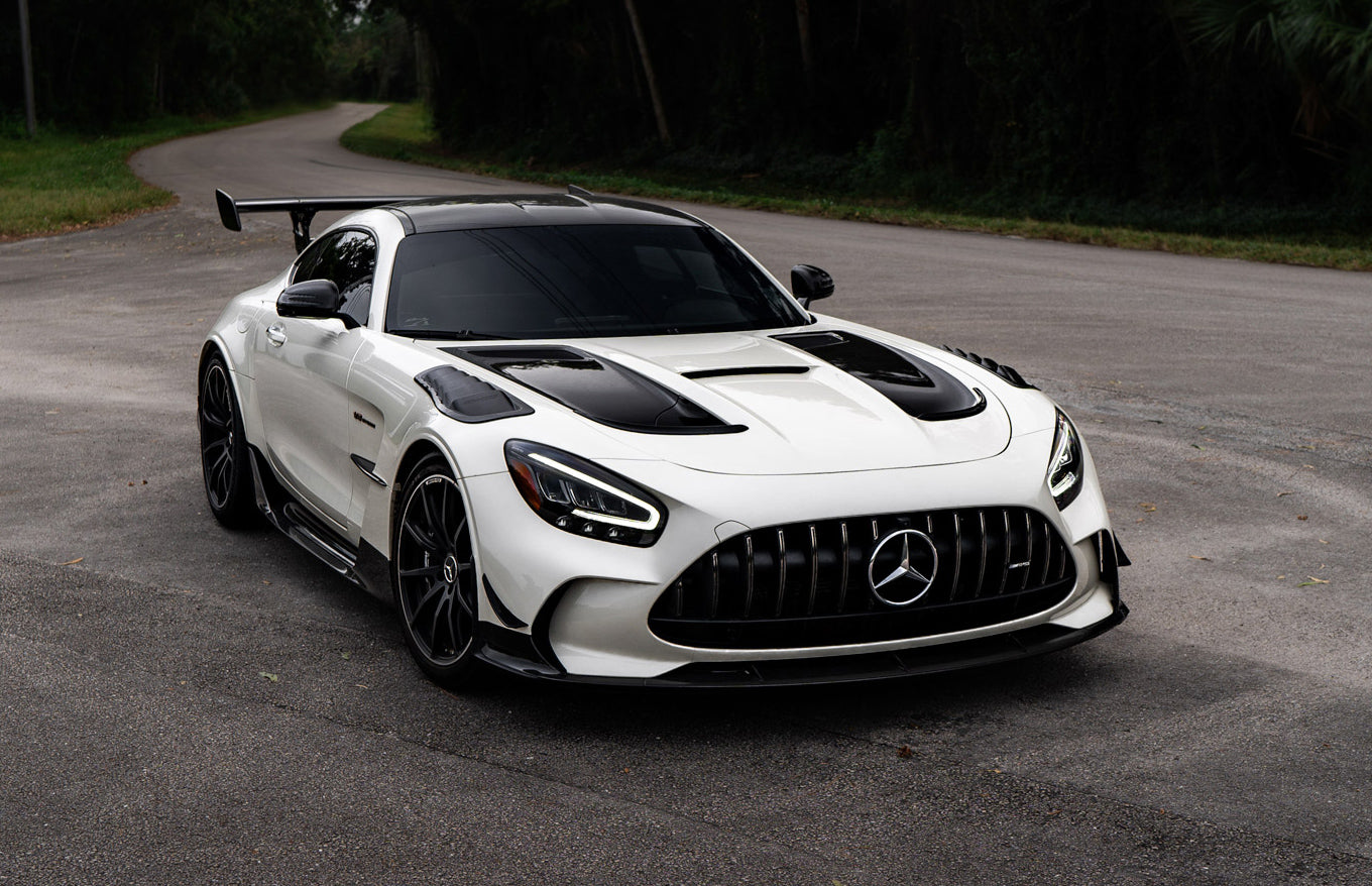 White AMG GT Black Series car front quarter with the inserts - Carbon Fender Extractor Inserts for the 2021 AMG GT Black Series