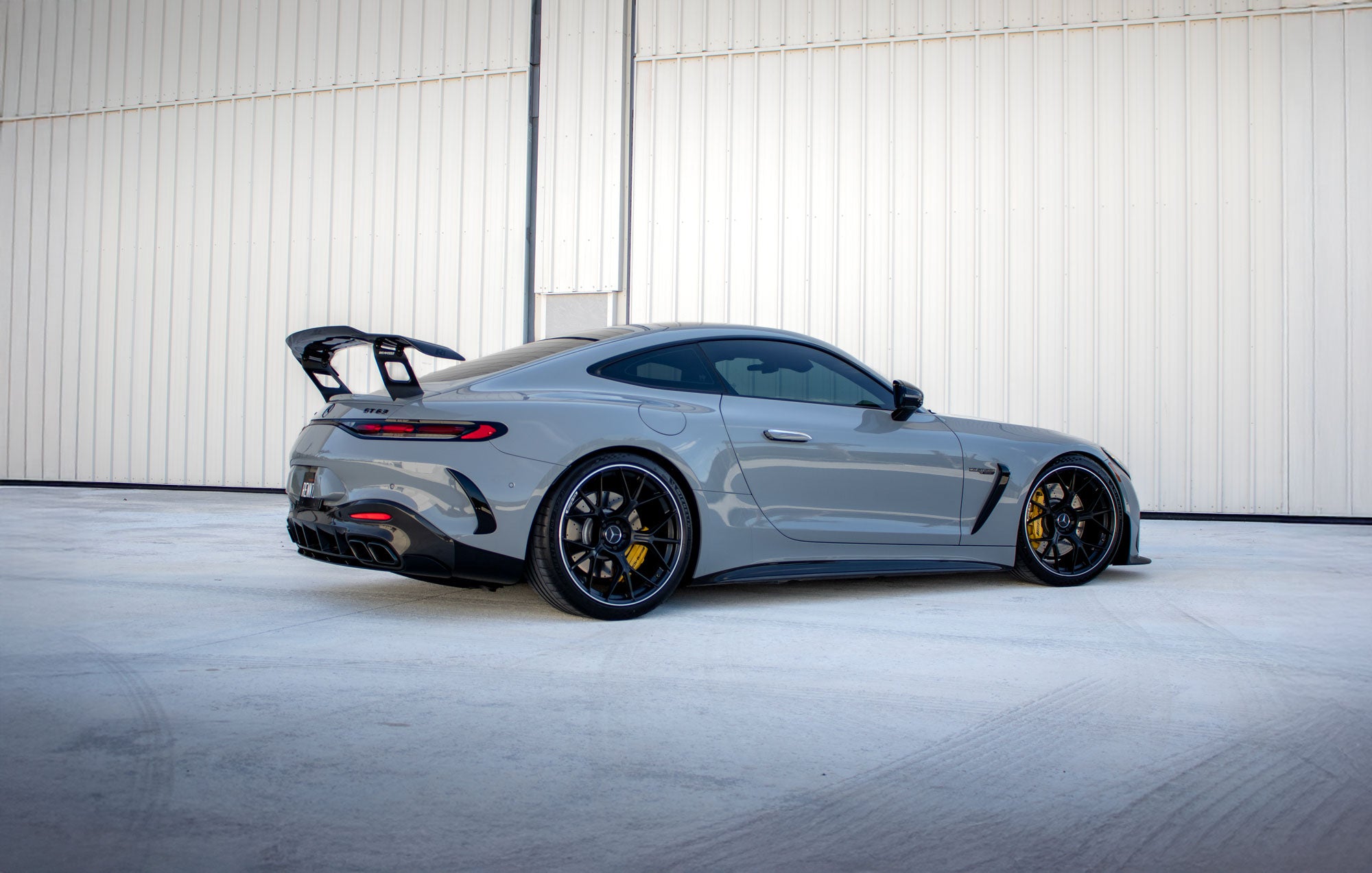 Grey AMG GT side profile with the RennTech rear wing fitted - Carbon Fiber Rear Wing for the 2024-2026 AMG GT 55 / GT 63 Coupe