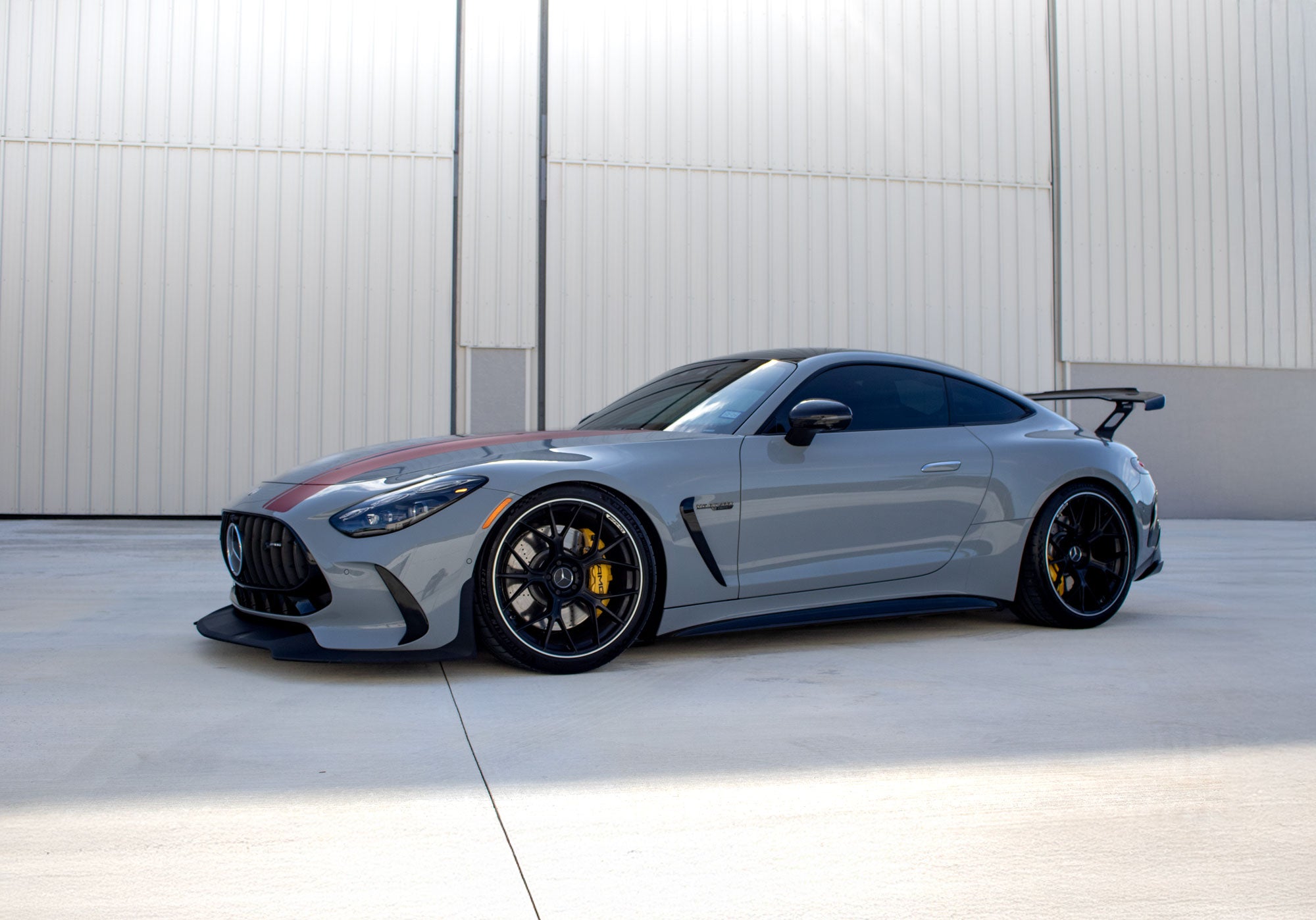 Grey AMG GT front three-quarter with the RennTech wing visible - Carbon Fiber Rear Wing for the 2024-2026 AMG GT 55 / GT 63 Coupe