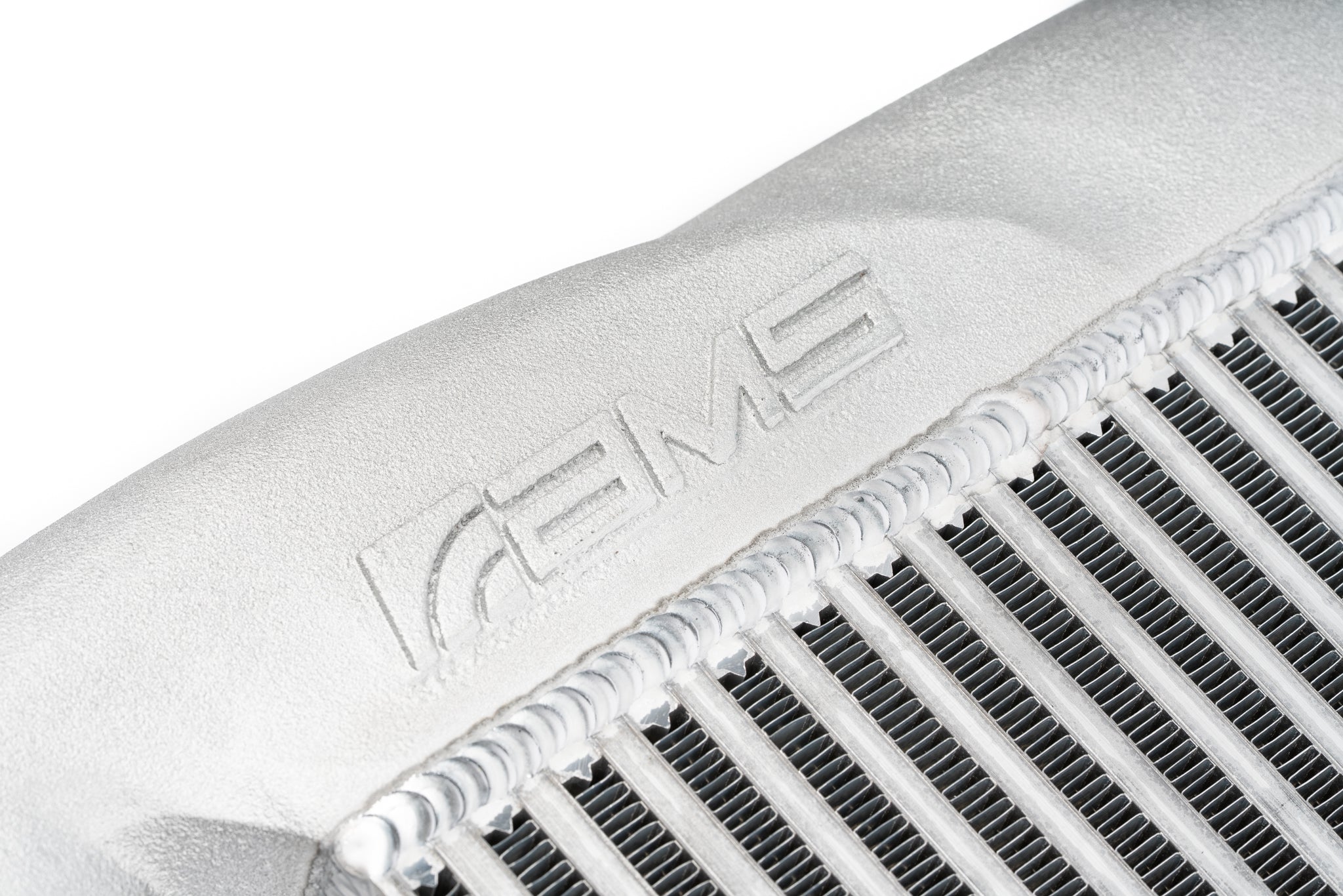 Cast aluminum end tank with AMS logo and bar and plate core on the AMS F150 High Mount Intercooler