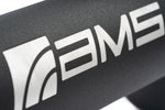Close up of the AMS logo on a black powder coated F150 intercooler pipe