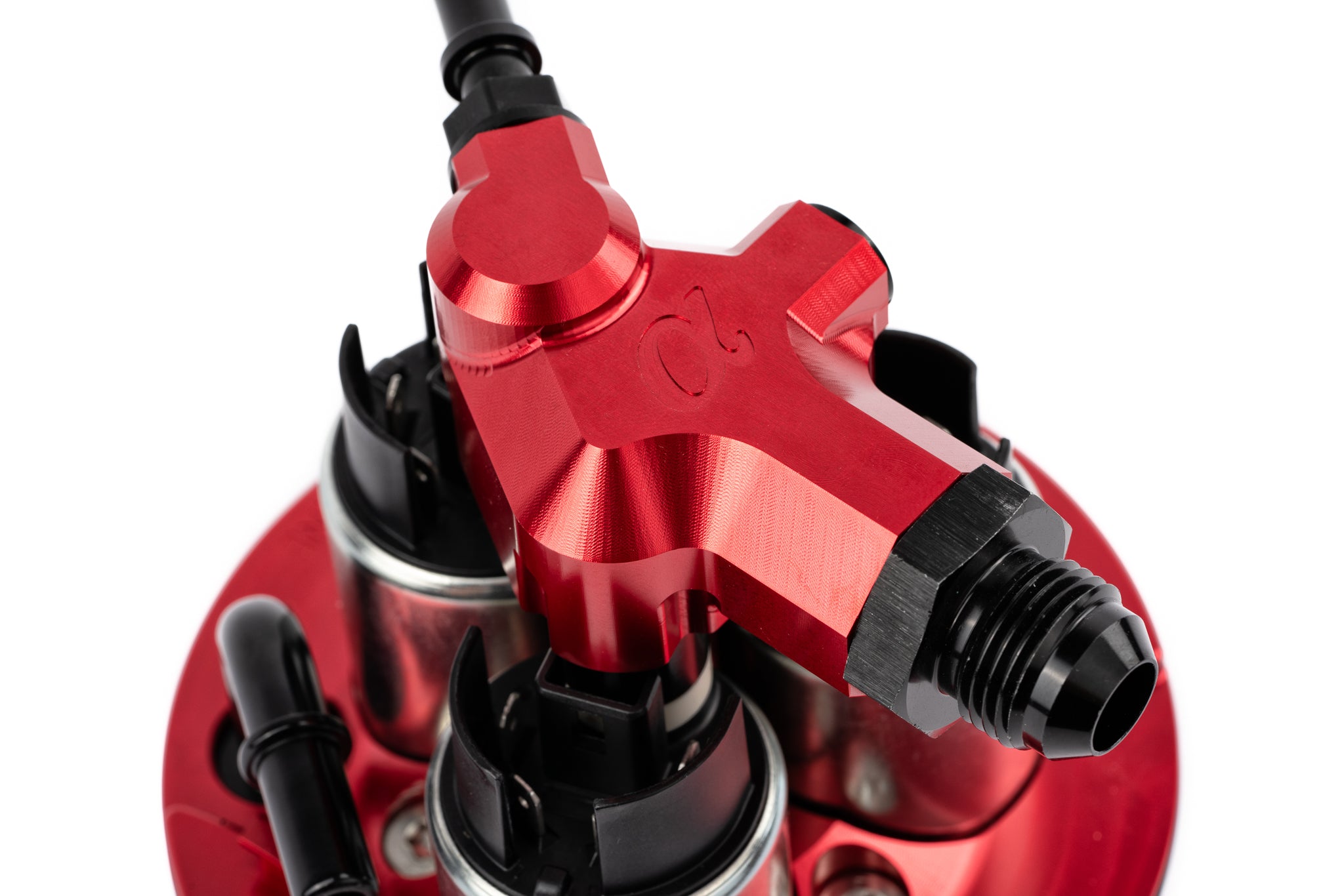 Red anodized outlet manifold on the AMS Huracan triple pump kit