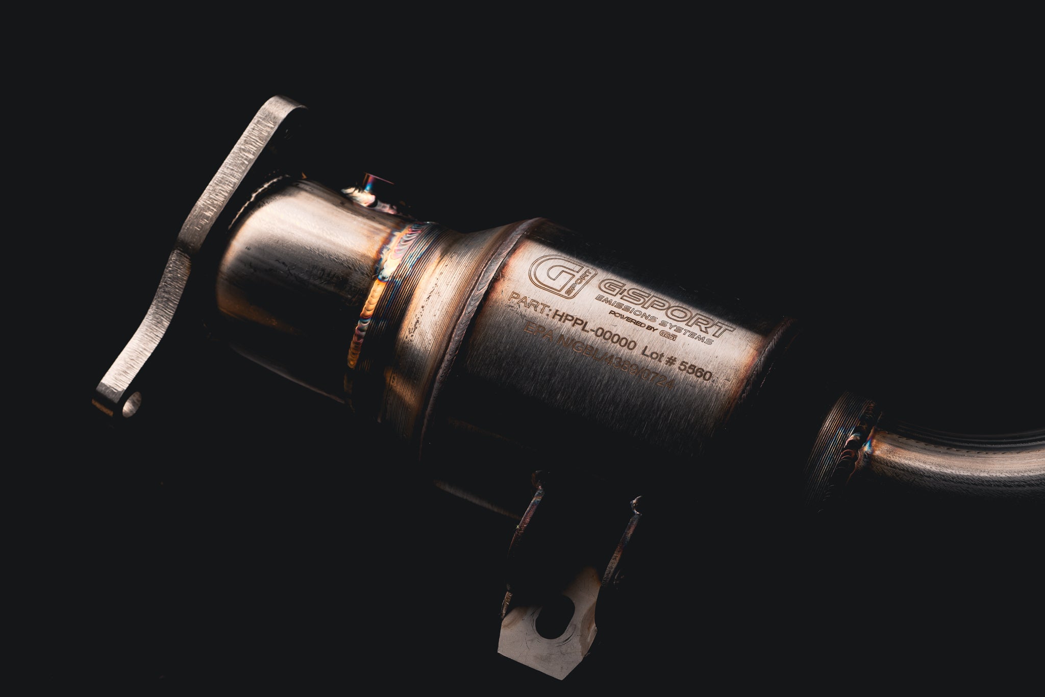 Close-up of a GESI G-Sport converter and mounting bracket on an AMS VR30 street lower downpipe