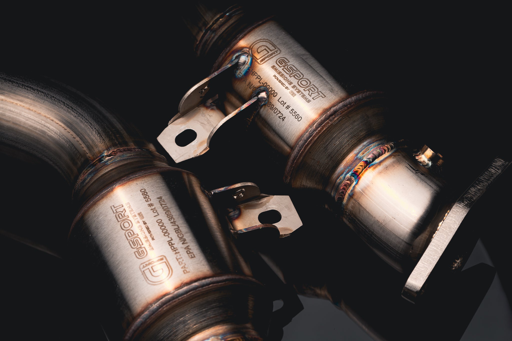 Detail of the integrated mounting brackets on the AMS street catted lower downpipes