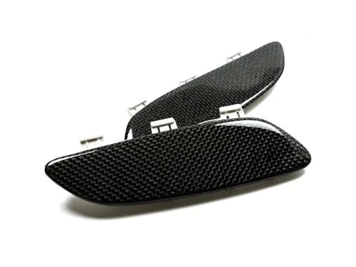 A front view of AUTOTECKNIC CARBON FIBER FRONT BUMPER REFLECTORS - BMW E90 E92 E93 M3 2007-2013 with white background