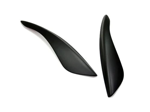 A front view of AUTOTECKNIC STEALTH BLACK HEADLIGHT COVERS - INFINITI G35 COUPE 2002-2007 with white background