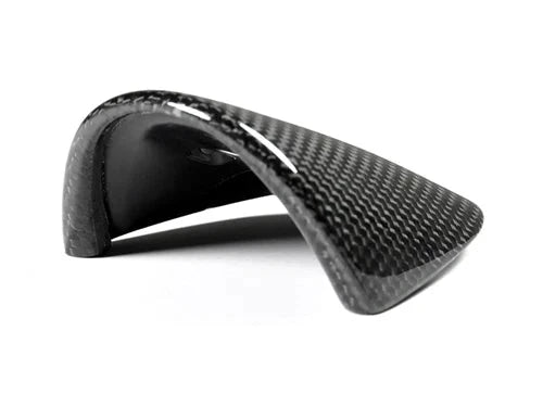 A front view of AUTOTECKNIC CARBON FIBER CHRONO EYE LID COVER - PORSCHE CARRERA 991 2012-2019 with white background