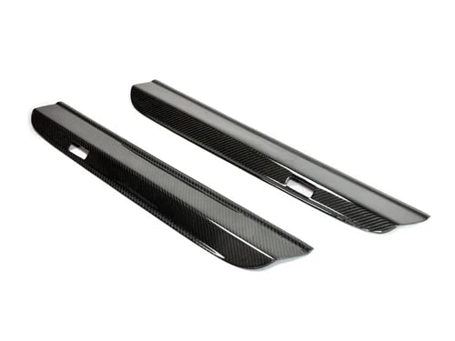 A front view of AUTOTECKNIC CARBON FIBER DOOR SILLS - PORSCHE 991 CARRERA MODELS 2012-2019 with white background