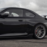 close side view of TRE Carbon Fiber Side Skirts for BMW G87 M2 TR87 2023+ fitted inside a car