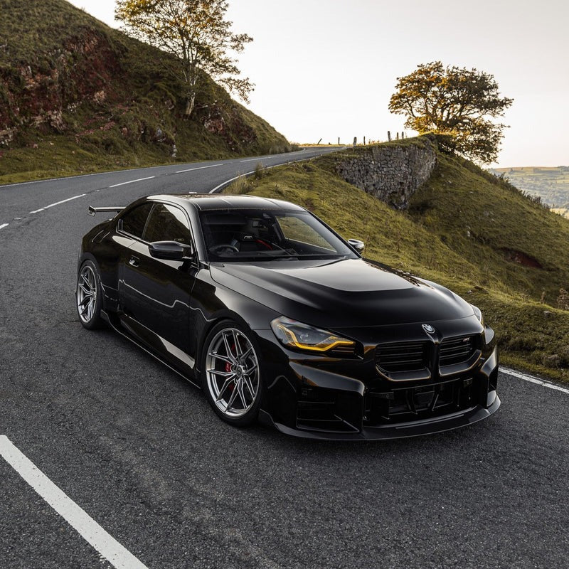 wide top view of TRE Carbon Fiber Side Skirts for BMW G87 M2 TR87 2023+ fitted inside a car