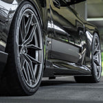 wide side view of TRE Carbon Fiber Side Skirts for BMW G87 M2 TR87 2023+ fitted inside a car