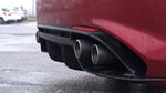 Capristo carbon twin tips in the diffuser of a red Giulia Quadrifoglio