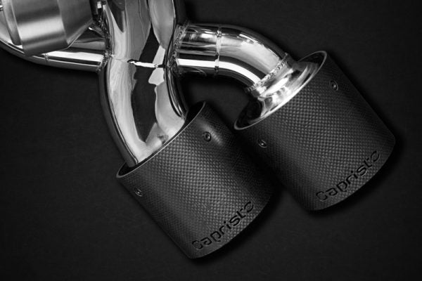 close view of Capristo OE Actuators Valved Exhaust System with Bevelled Carbon Fiber Tips E2P for Audi RS6 C8 2019-2025 with black background