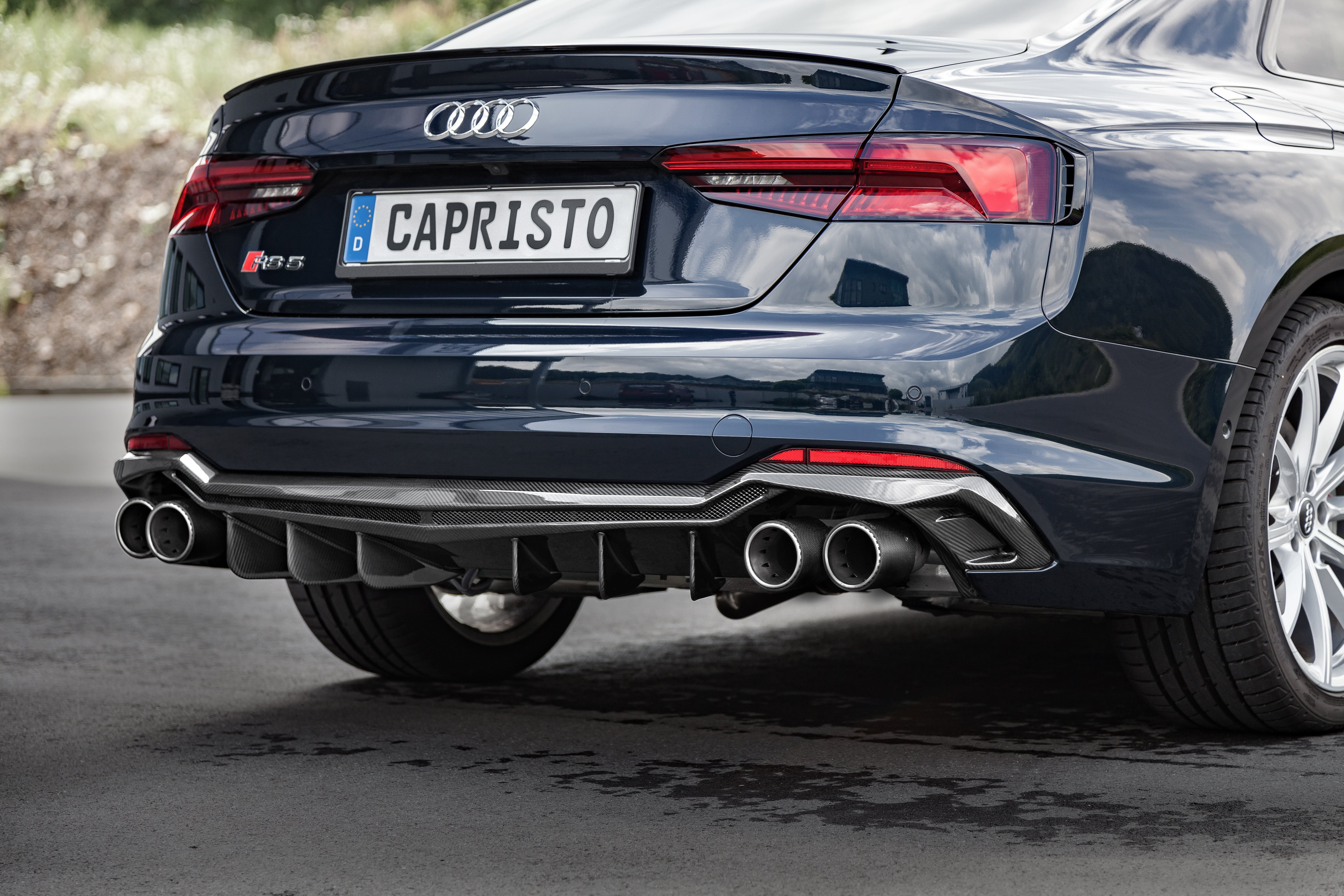 Dark blue Audi RS5 F5 coupe rear with Capristo carbon fiber rear diffuser