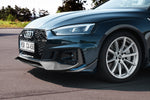 Dark green Audi RS5 front three-quarter with Capristo carbon fiber front spoiler