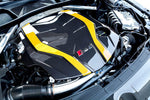 Close-up of Capristo carbon fiber engine cover with yellow stripes on Audi RS5 F5